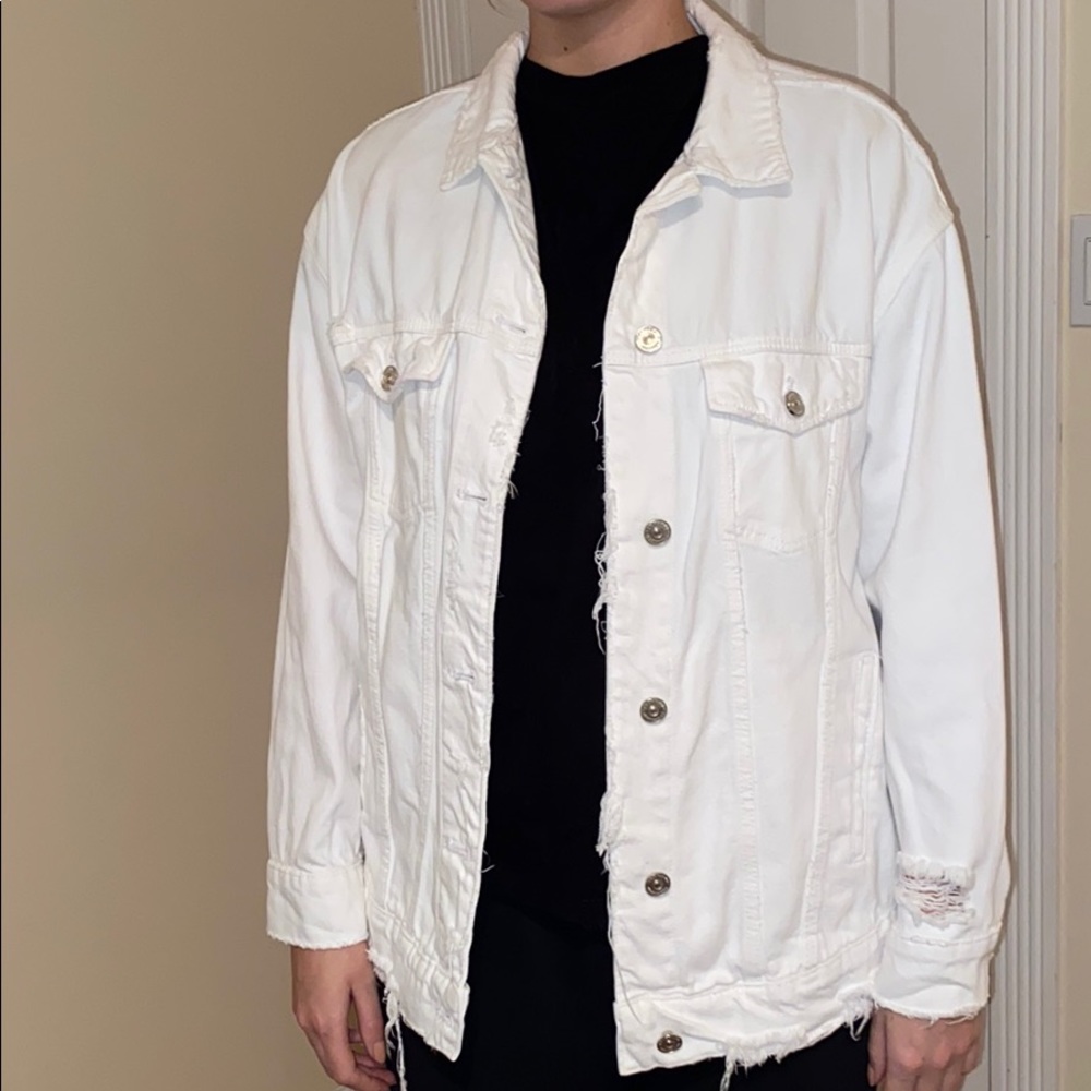 White jean jacket with tassels